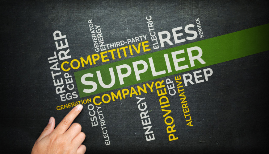 A hand points at a cluster of words related to the energy sector. Supplier is in bold green, surrounded by terms like competitive, energy, provider, company, retail, and service on a dark background.